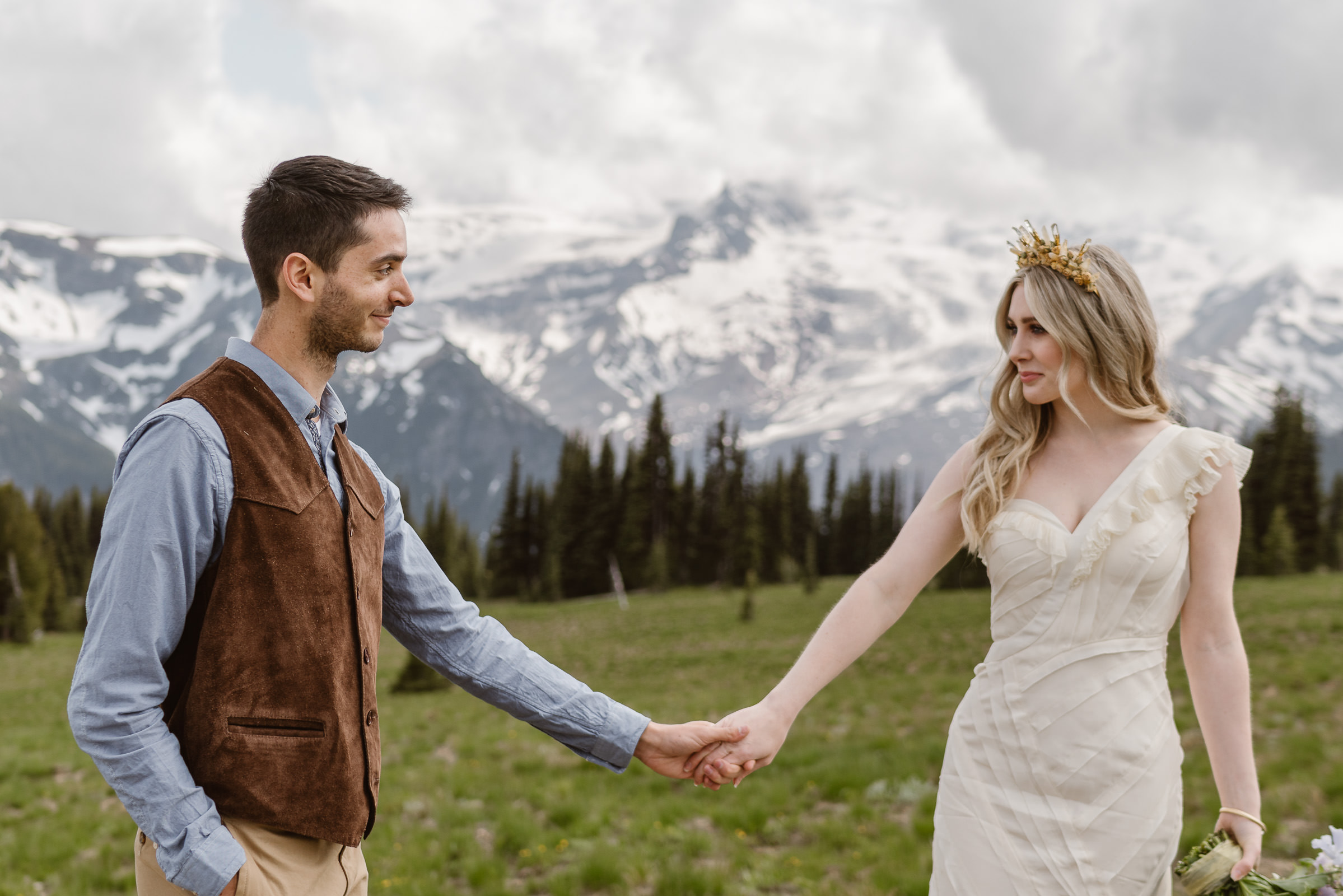 Couple holding hands as they elope at Mount Rainier National Park