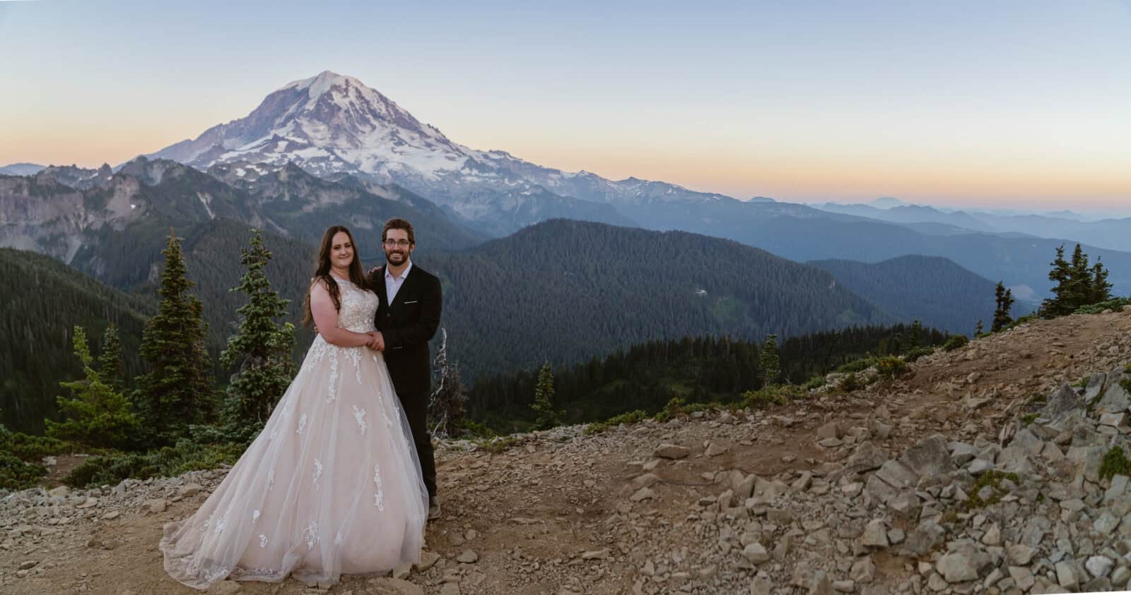 Couple enjoys sunset at Mount Rainier National Park on their elopement day