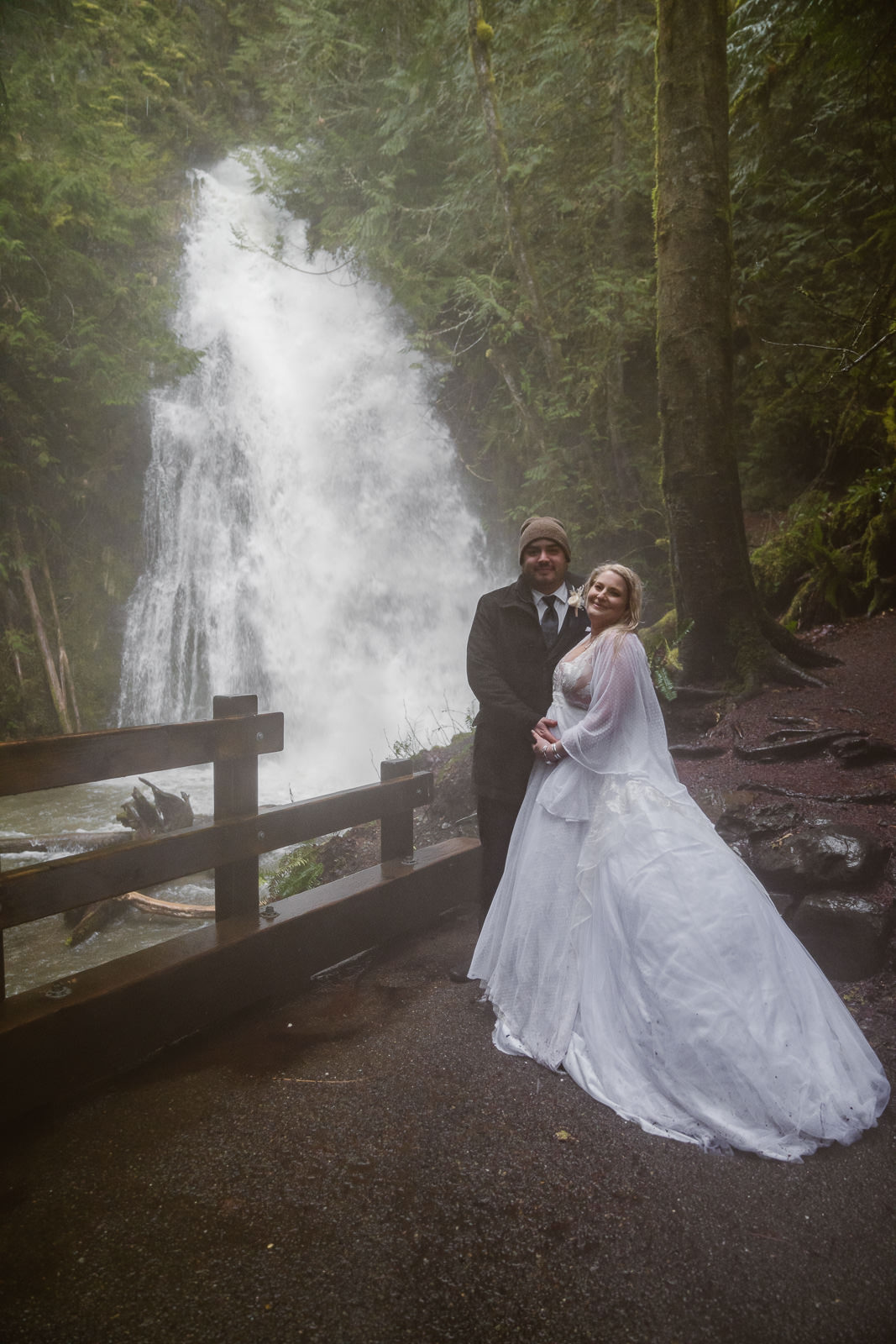Couple elopes at Madison Falls in Olympic National Park during rain storm