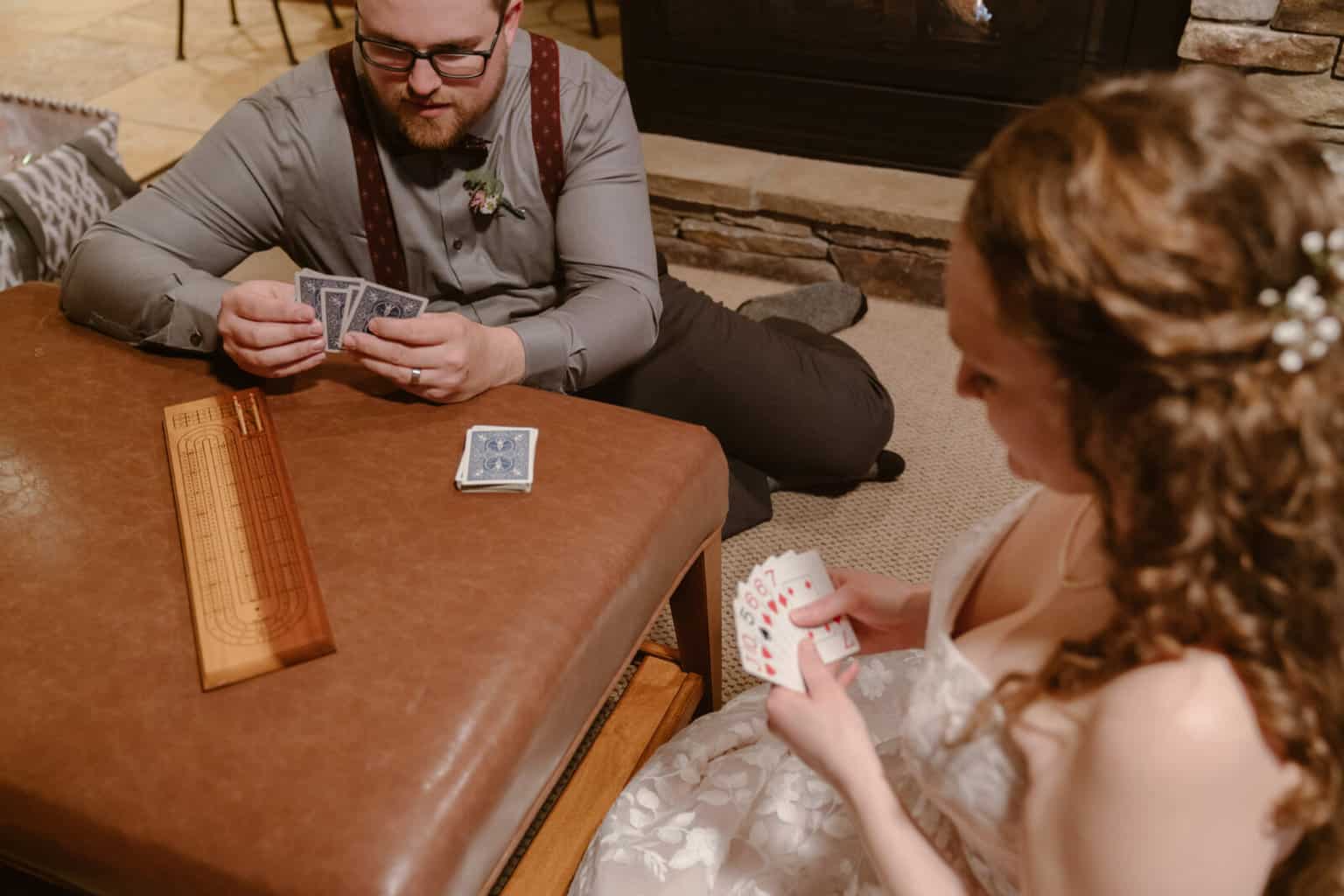 Couple plays card games on their adventure elopement day