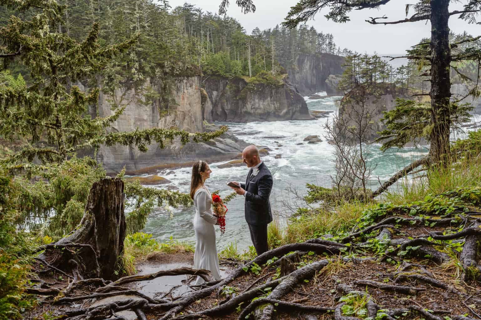 Couple reads vows to each other at Cape Flattery with Outshined Photography